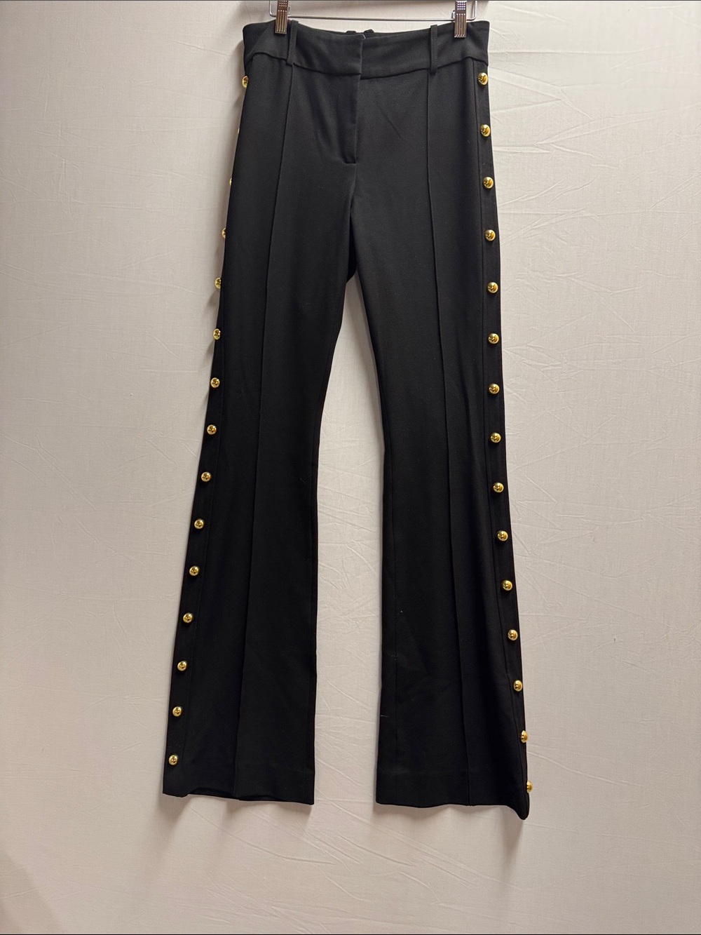 Veronica Beard Black Flared Pants with Gold Button Trim
No stains 
Cool pant!!